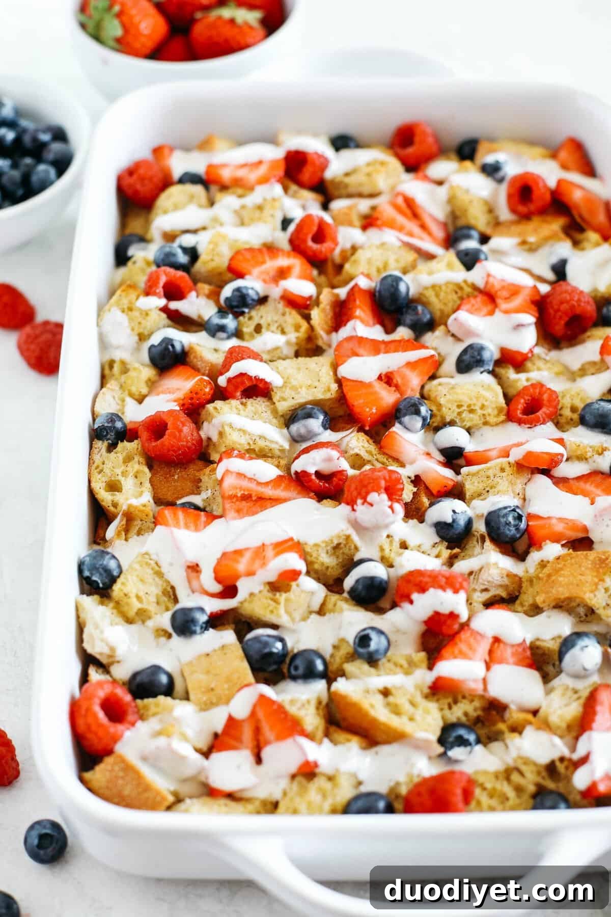 Mixed Berry French Toast Casserole Recipe 4 Warm and flavorful Mixed Berry French Toast Casserole with a delicious cream cheese drizzle that can easily be made the night before for the perfect morning breakfast!