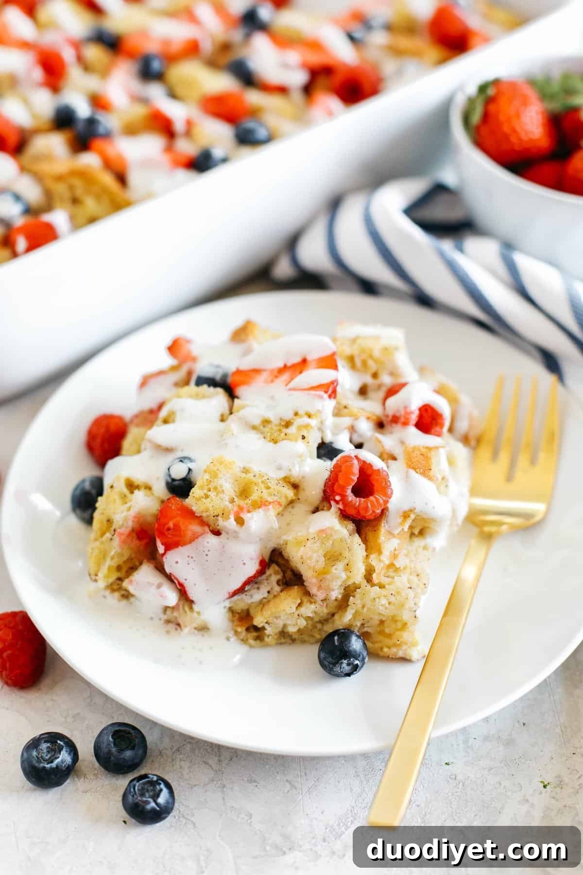 Warm and flavorful Mixed Berry French Toast Casserole with a delicious cream cheese drizzle that can easily be made the night before for the perfect morning breakfast!