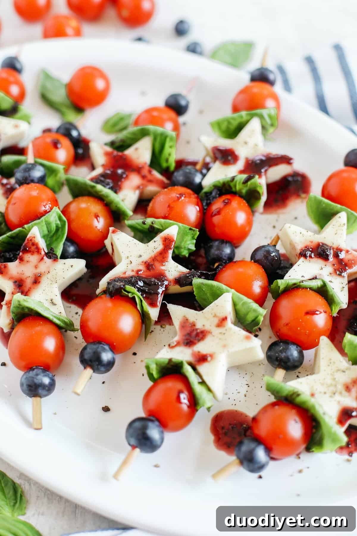 These Caprese Skewers with Blueberry Balsamic Glaze are healthy, incredibly delicious and make the perfect festive appetizer for Memorial Day, 4th of July or Labor Day weekend!