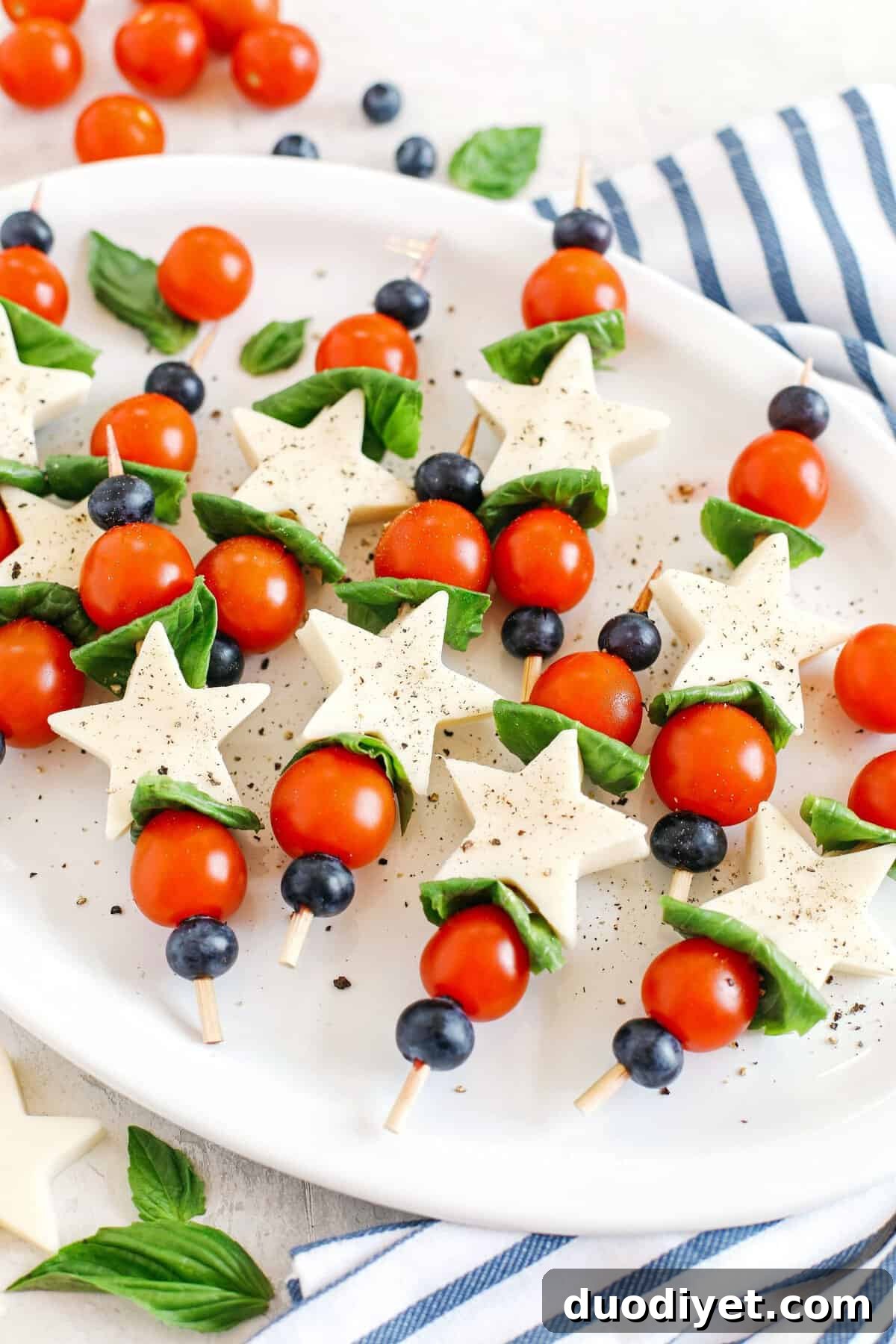 Caprese skewers with blueberry balsamic glaze close-up