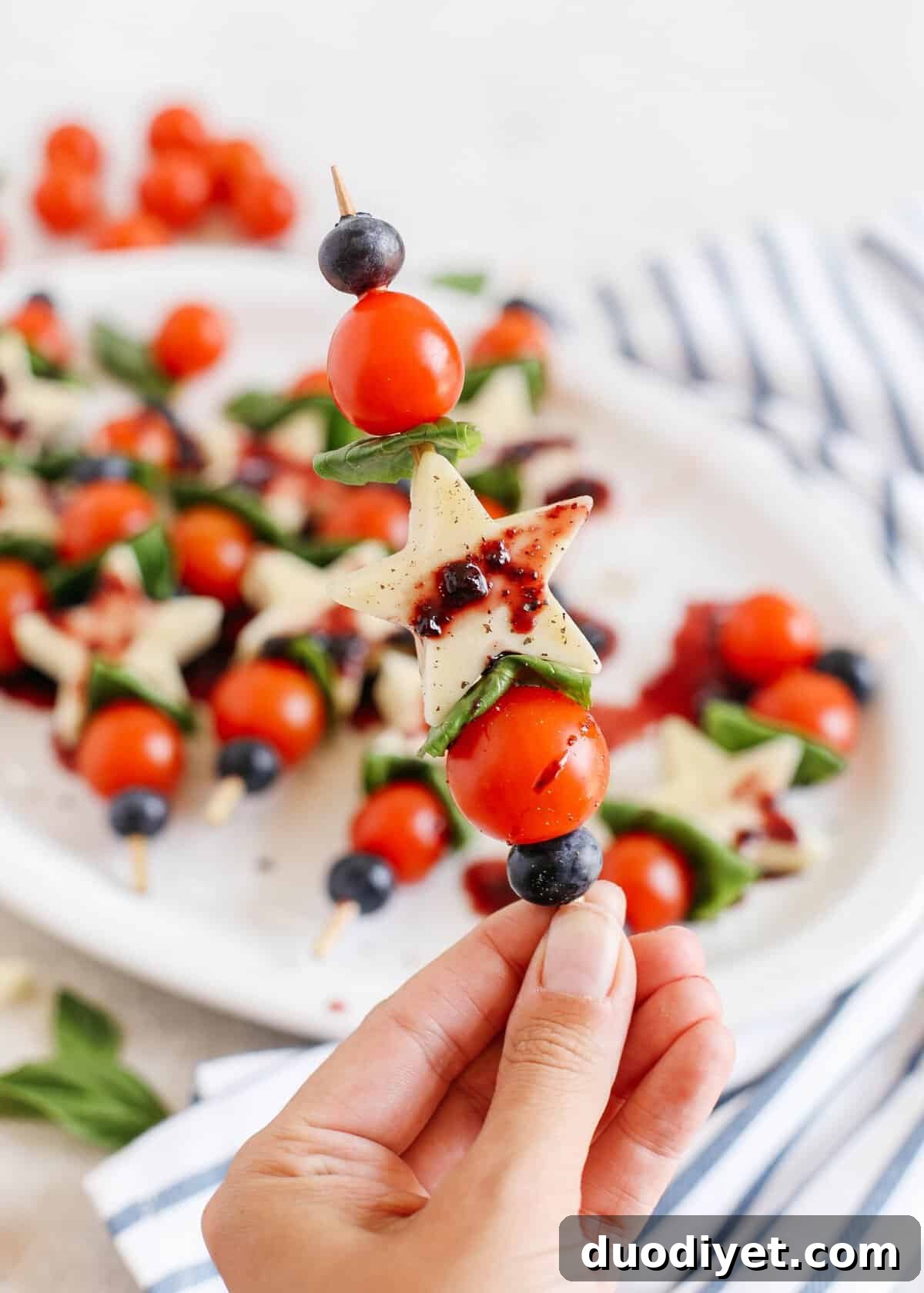 These Caprese Skewers with Blueberry Balsamic Glaze are healthy, incredibly delicious and make the perfect festive appetizer for Memorial Day, 4th of July or Labor Day weekend!