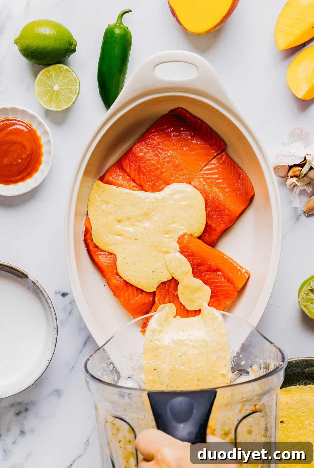 These Mango Sriracha Salmon Tacos make the perfect summer meal easily made in under 20 minutes!  These salmon tacos are simple, fresh and topped with the most delicious mango salsa!
