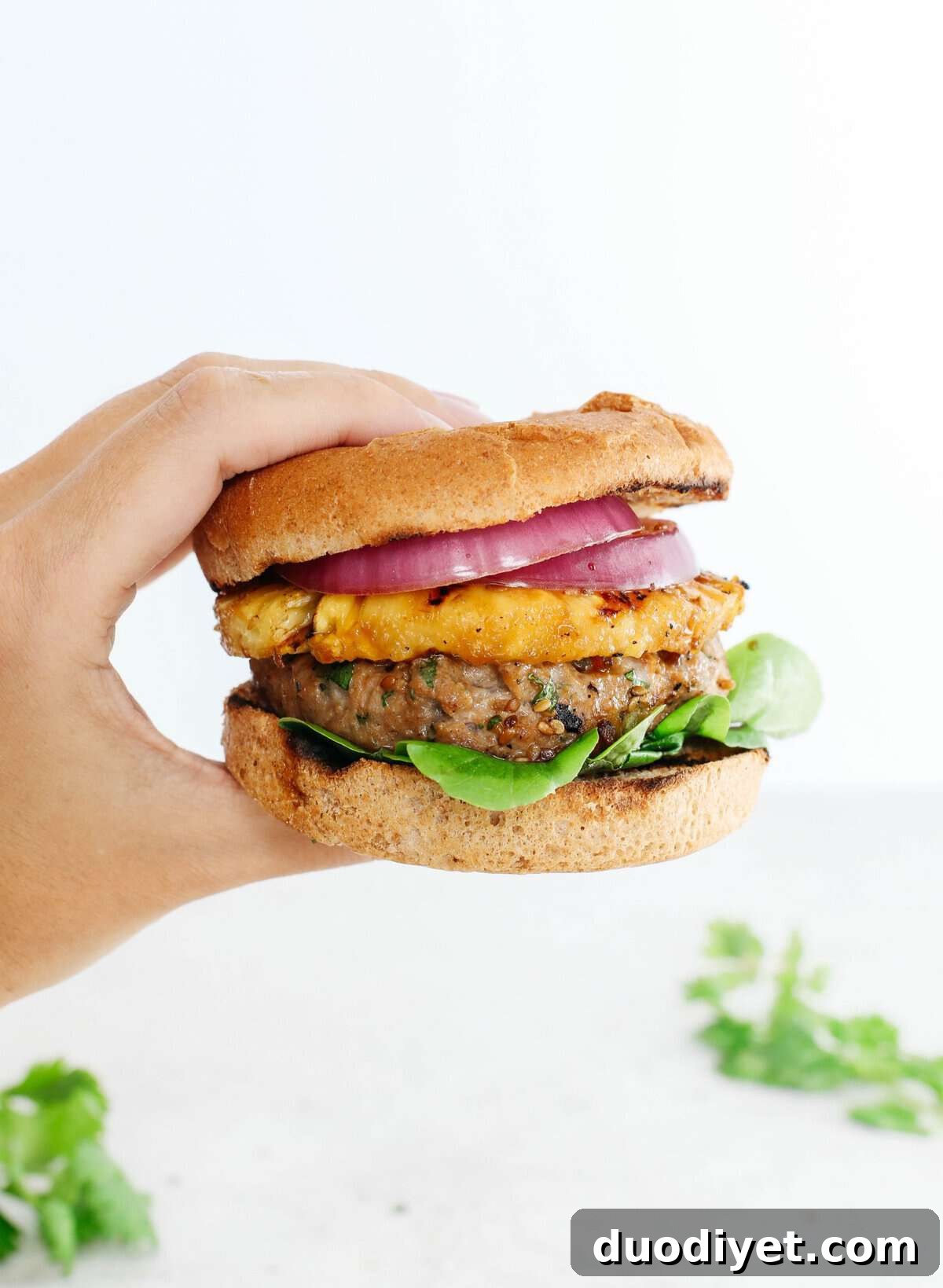 These delicious Hawaiian Turkey Burgers are packed with tons of flavor, made with a healthy homemade teriyaki sauce and topped with fresh grilled pineapple!