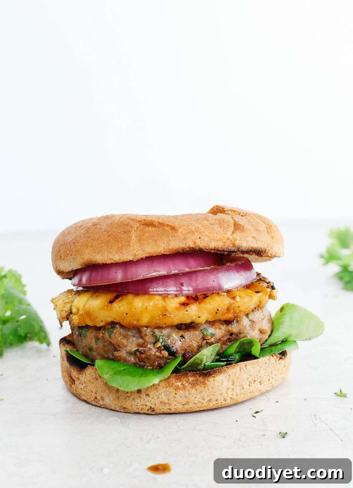 These delicious Hawaiian Turkey Burgers are packed with tons of flavor, made with a healthy homemade teriyaki sauce and topped with fresh grilled pineapple!