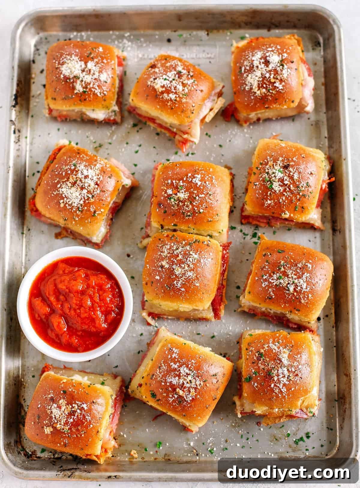 Hot Italian Sliders Recipe with Melted Provolone 6 Delicious Hot Italian Sliders perfect for game day that are layered with slices of ham, salami, pepperoni and provolone with a homemade roasted red pepper spread!