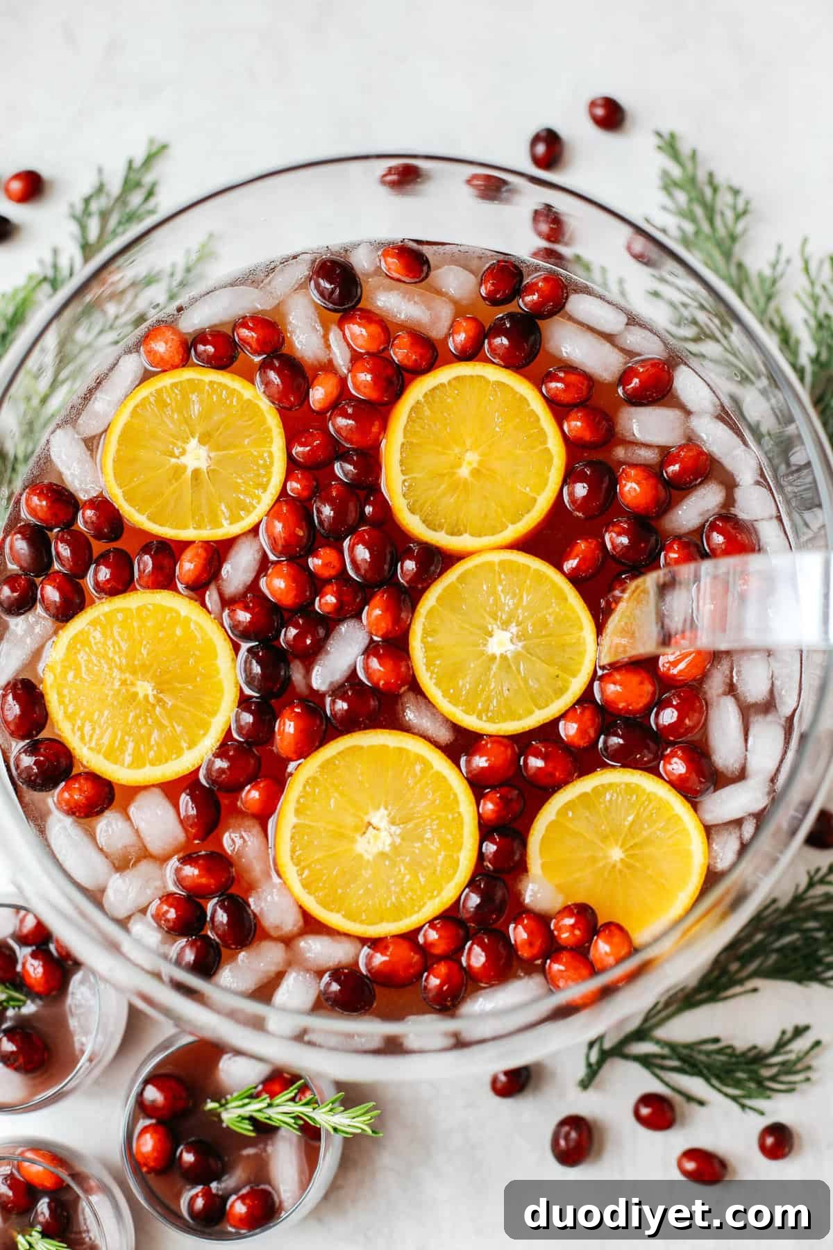 Sparkling Christmas Punch Recipe for Festive Holiday Parties 2 This Sparkling Christmas Punch makes the perfect addition to any holiday party or gathering with a delicious blend of cranberries and oranges all marinated together in one festive cocktail!
