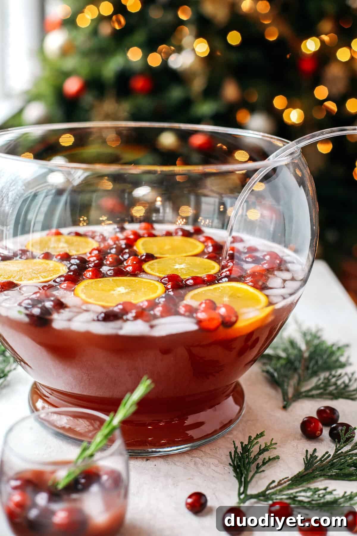 Sparkling Christmas Punch Recipe for Festive Holiday Parties 3 This Sparkling Christmas Punch makes the perfect addition to any holiday party or gathering with a delicious blend of cranberries and oranges all marinated together in one festive cocktail!