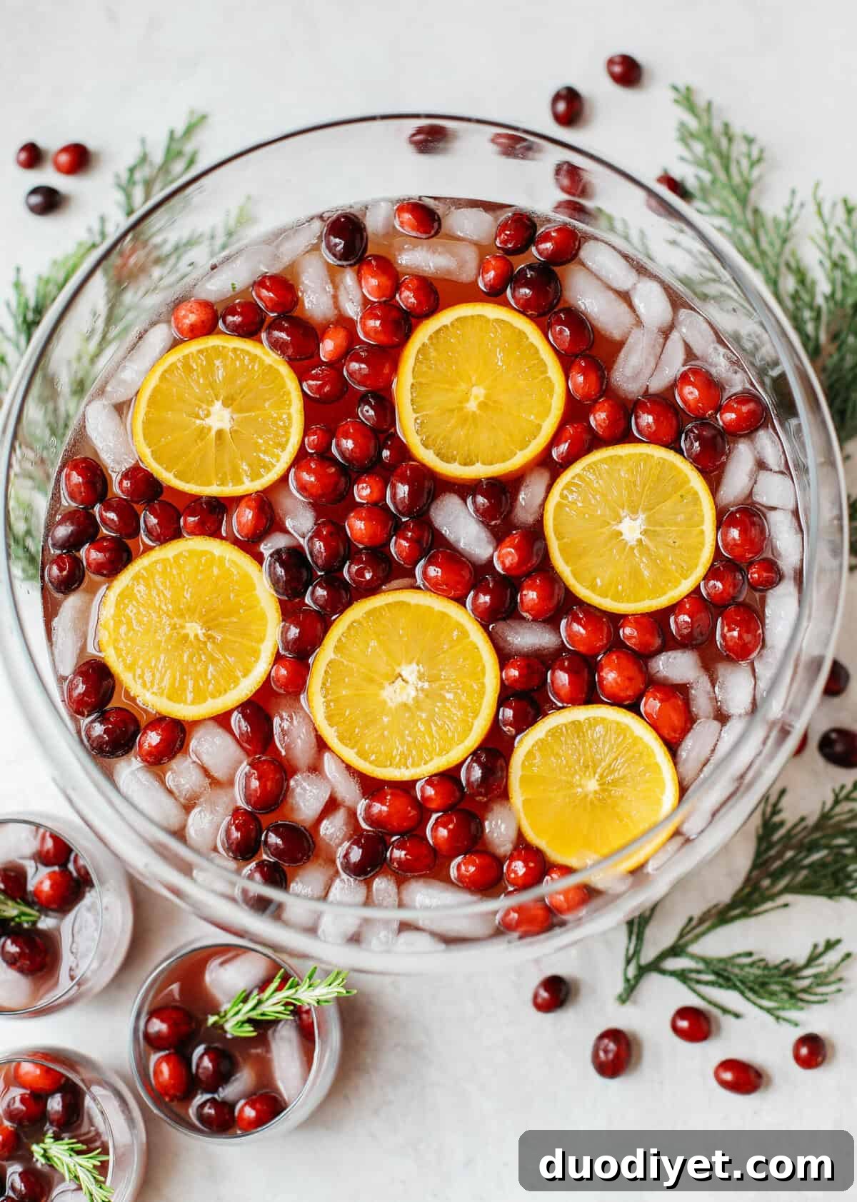 Sparkling Christmas Punch Recipe for Festive Holiday Parties 4 This Sparkling Christmas Punch makes the perfect addition to any holiday party or gathering with a delicious blend of cranberries and oranges all marinated together in one festive cocktail!