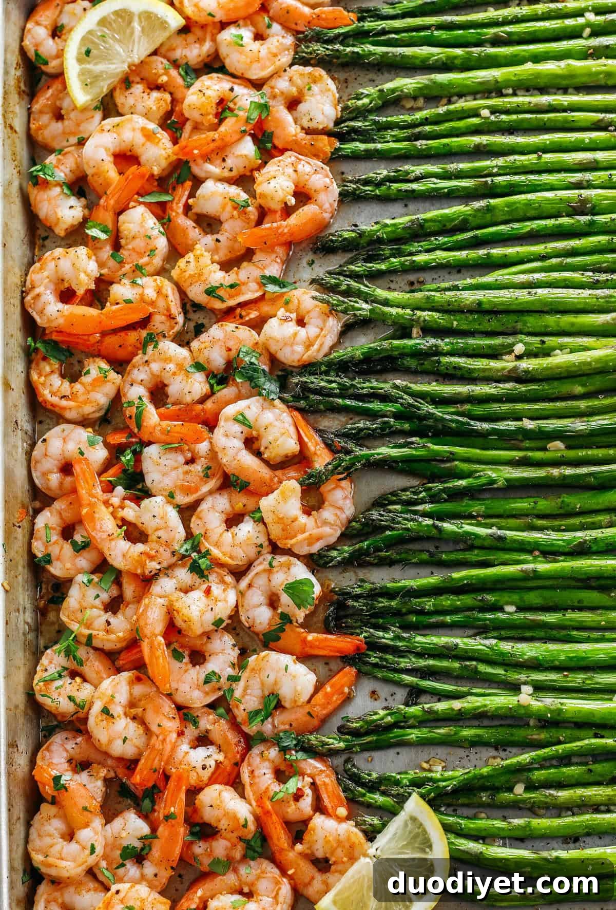 This Sheet Pan Lemon Garlic Shrimp and Asparagus is the perfect weeknight dinner loaded with flavor and easily made all in one pan in under 20 minutes!