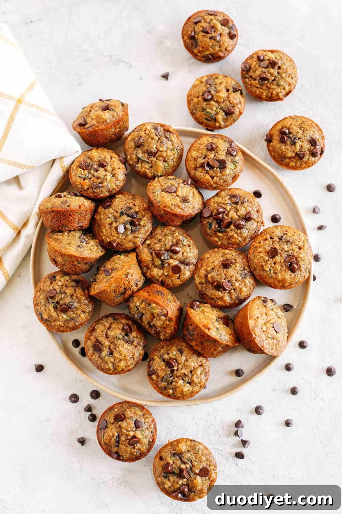 Moist Banana Zucchini Muffins with Chocolate Chips 3 Healthy bite-sized Chocolate Chip Banana Zucchini Muffins that are moist and delicious with hidden veggies and naturally sweetened with banana and honey!