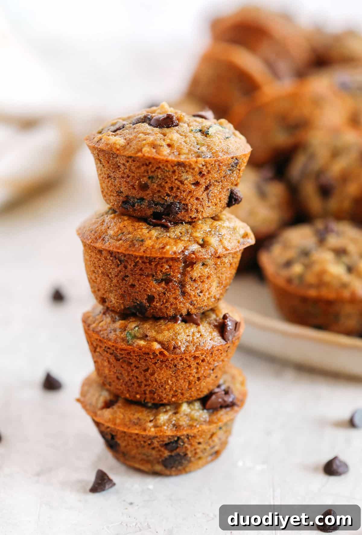 Moist Banana Zucchini Muffins with Chocolate Chips 4 Healthy bite-sized Chocolate Chip Banana Zucchini Muffins that are moist and delicious with hidden veggies and naturally sweetened with banana and honey!