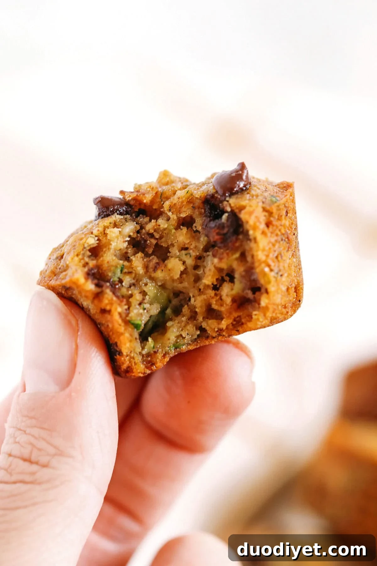 Moist Banana Zucchini Muffins with Chocolate Chips 5 Healthy bite-sized Chocolate Chip Banana Zucchini Muffins that are moist and delicious with hidden veggies and naturally sweetened with banana and honey!