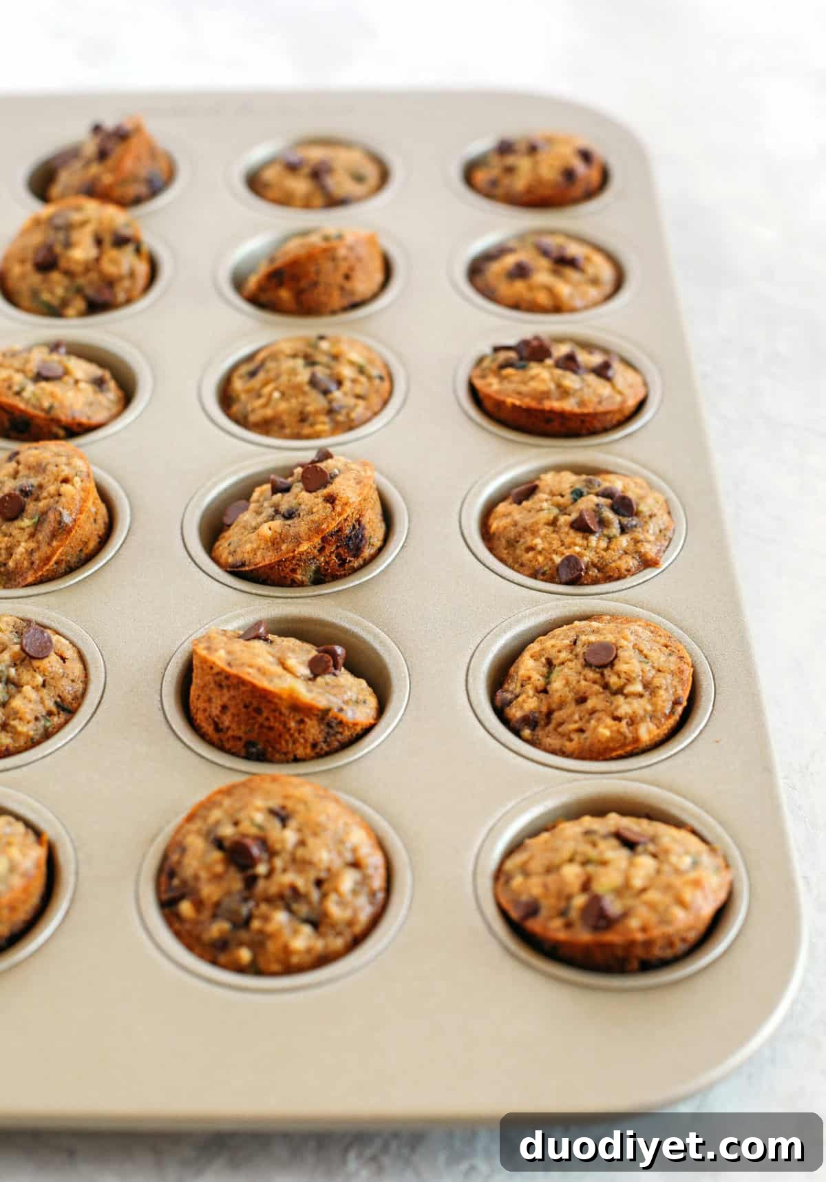 Moist Banana Zucchini Muffins with Chocolate Chips 6 Healthy bite-sized Chocolate Chip Banana Zucchini Muffins that are moist and delicious with hidden veggies and naturally sweetened with banana and honey!