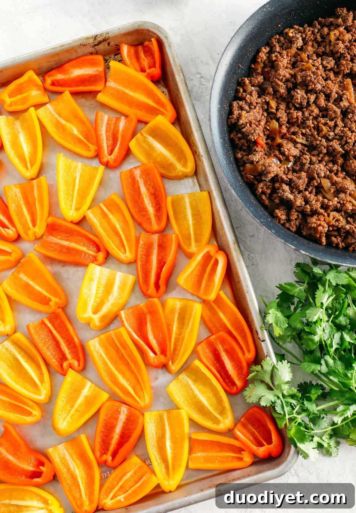 These Sheet Pan Loaded Bell Pepper Nachos are packed with all your favorite flavors and fun toppings making them the perfect low carb appetizer to enjoy on game day!