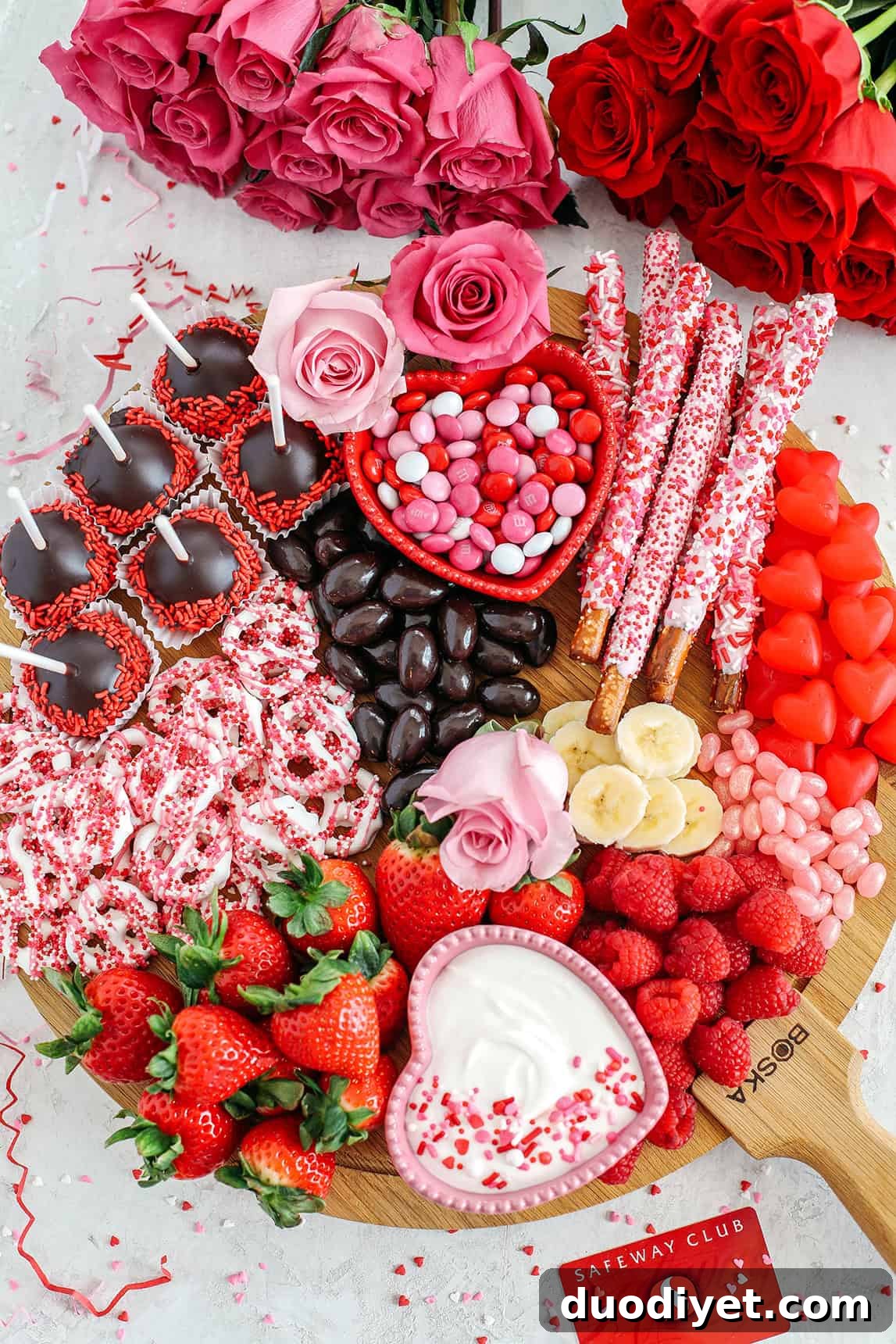 Valentine's Day Dessert Charcuterie Board 2 Celebrate Valentine's Day with a fun and festive dessert board made with healthier options like yogurt-dipped pretzels, chocolate covered almonds, fresh fruit and a honey yogurt dipping sauce!