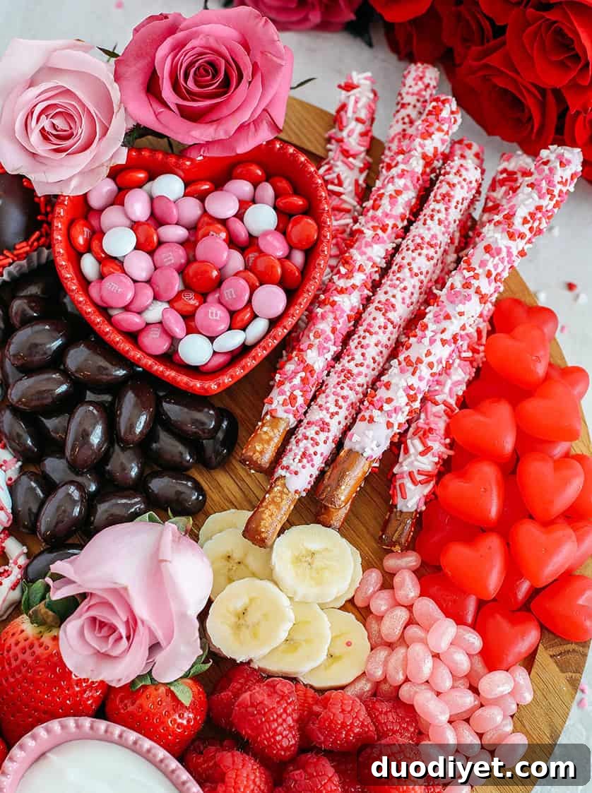Valentine's Day Dessert Charcuterie Board 5 Celebrate Valentine's Day with a fun and festive dessert board made with healthier options like yogurt-dipped pretzels, chocolate covered almonds, fresh fruit and a honey yogurt dipping sauce!