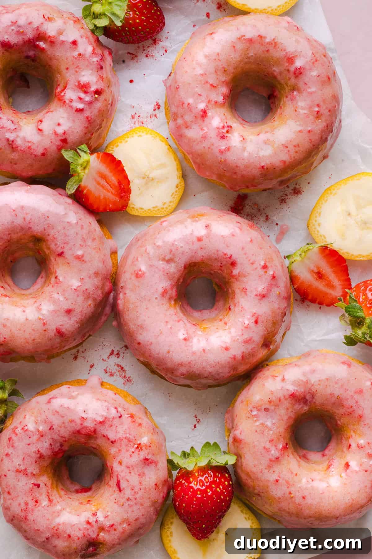 These Gluten-Free Strawberry Banana Donuts are soft, fluffy, and naturally sweetened with ripe bananas and fresh strawberries. These donuts are baked, not fried, and topped with a sweet strawberry glaze!