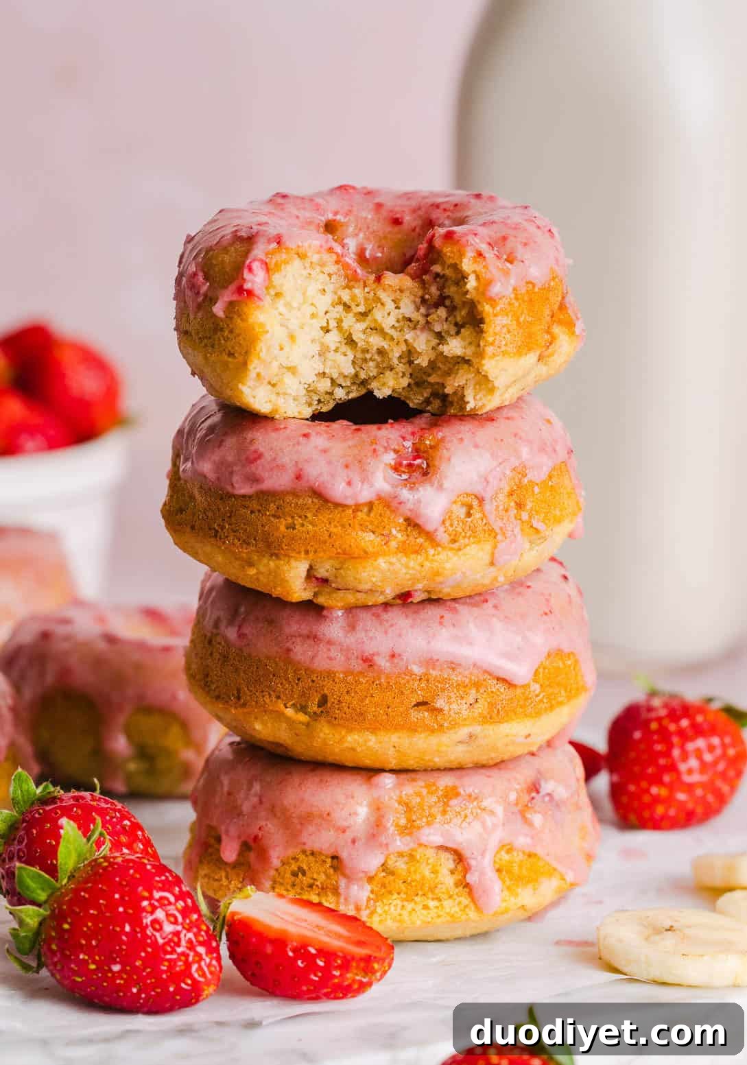 Stack of strawberry banana donuts