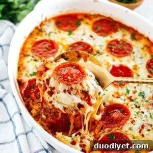 This Spaghetti Squash Pizza Casserole is the perfect low carb comfort food that is delicious, super filling and made with seasoned ground beef, melty cheese and your favorite marinara!