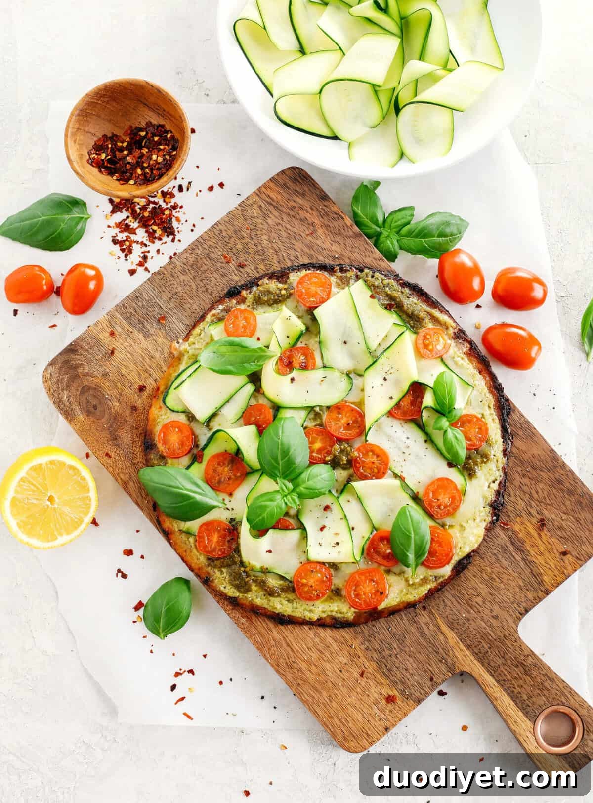 Cauliflower Pizza with Fresh Garden Pesto 7 Garden Pesto Cauliflower Pizza loaded with fresh tomatoes, zucchini, homemade basil pesto and ricotta all topped on a crispy cauliflower crust for a delicious low carb meal in just 15 minutes!