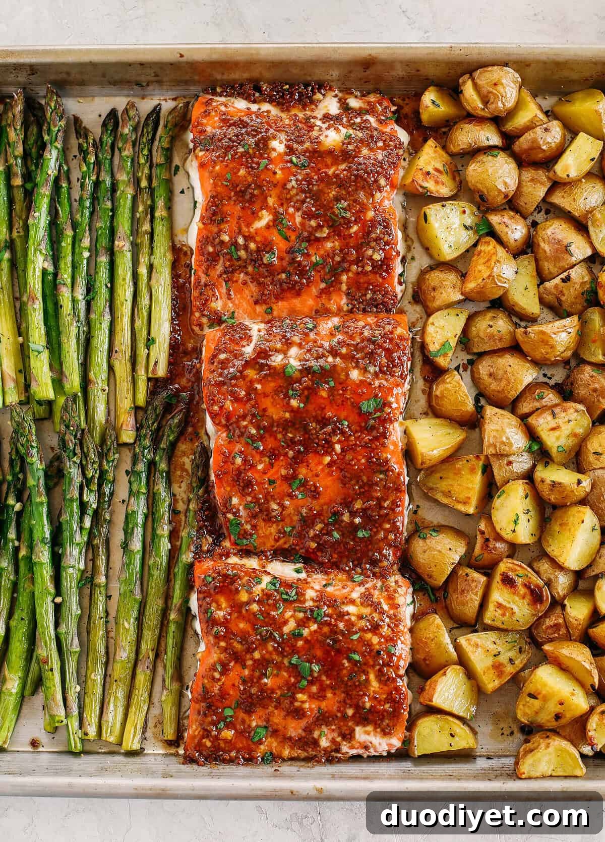 Sheet-Pan Salmon with Maple Dijon Glaze 2 Sheet Pan Maple Dijon Glazed Salmon with roasted asparagus and tender seasoned potatoes make the perfect weeknight dinner that is easily made all in one pan in just 30 minutes!