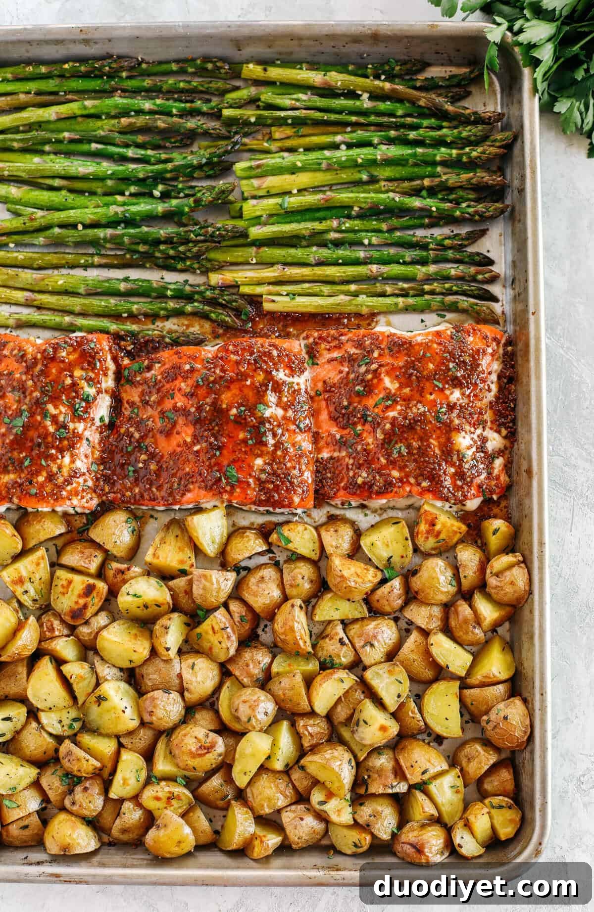 Maple-Dijon Glazed Sheet-Pan Salmon 3 Sheet Pan Maple Dijon Glazed Salmon with roasted asparagus and tender seasoned potatoes make the perfect weeknight dinner that is easily made all in one pan in just 30 minutes!