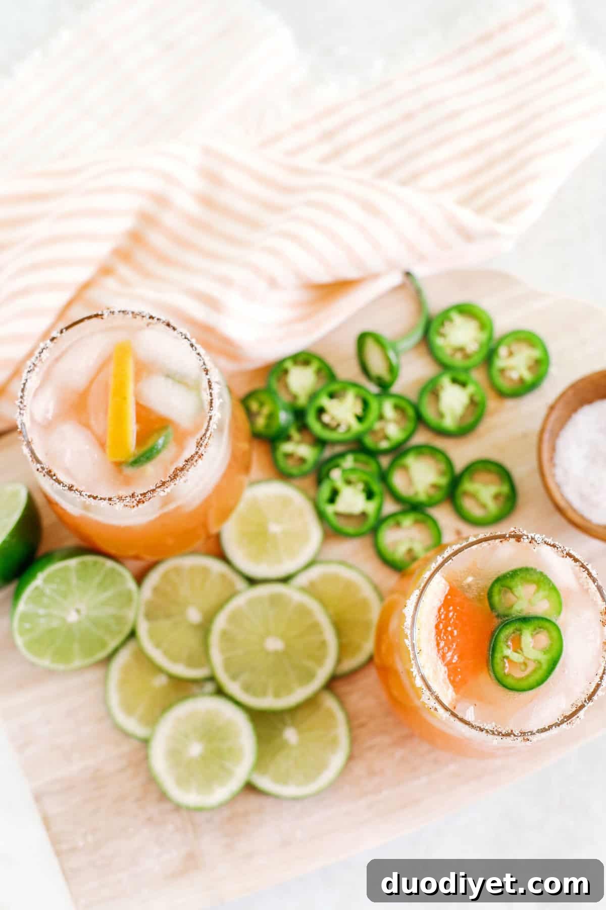Spicy Grapefruit Paloma Cocktail Recipe 3 Spicy Grapefruit Paloma in a glass with a rim and jalapeño garnish
