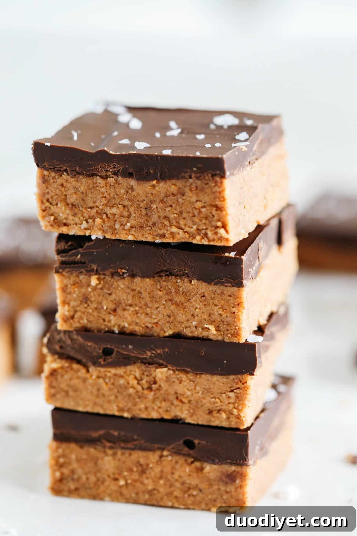 These Dark Chocolate Almond Butter Bars are rich, fudgy and make the perfect sweet treat with just a few simple ingredients and zero baking required!