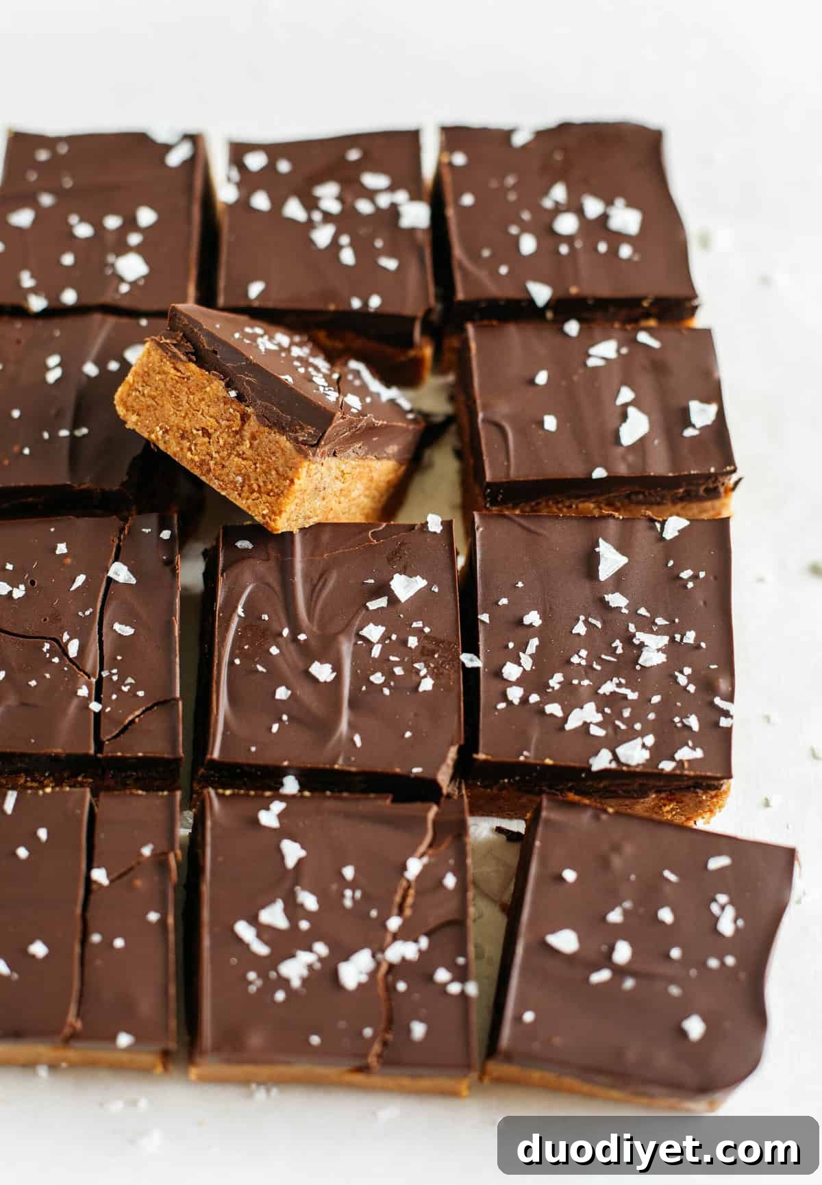 These Dark Chocolate Almond Butter Bars are rich, fudgy and make the perfect sweet treat with just a few simple ingredients and zero baking required!