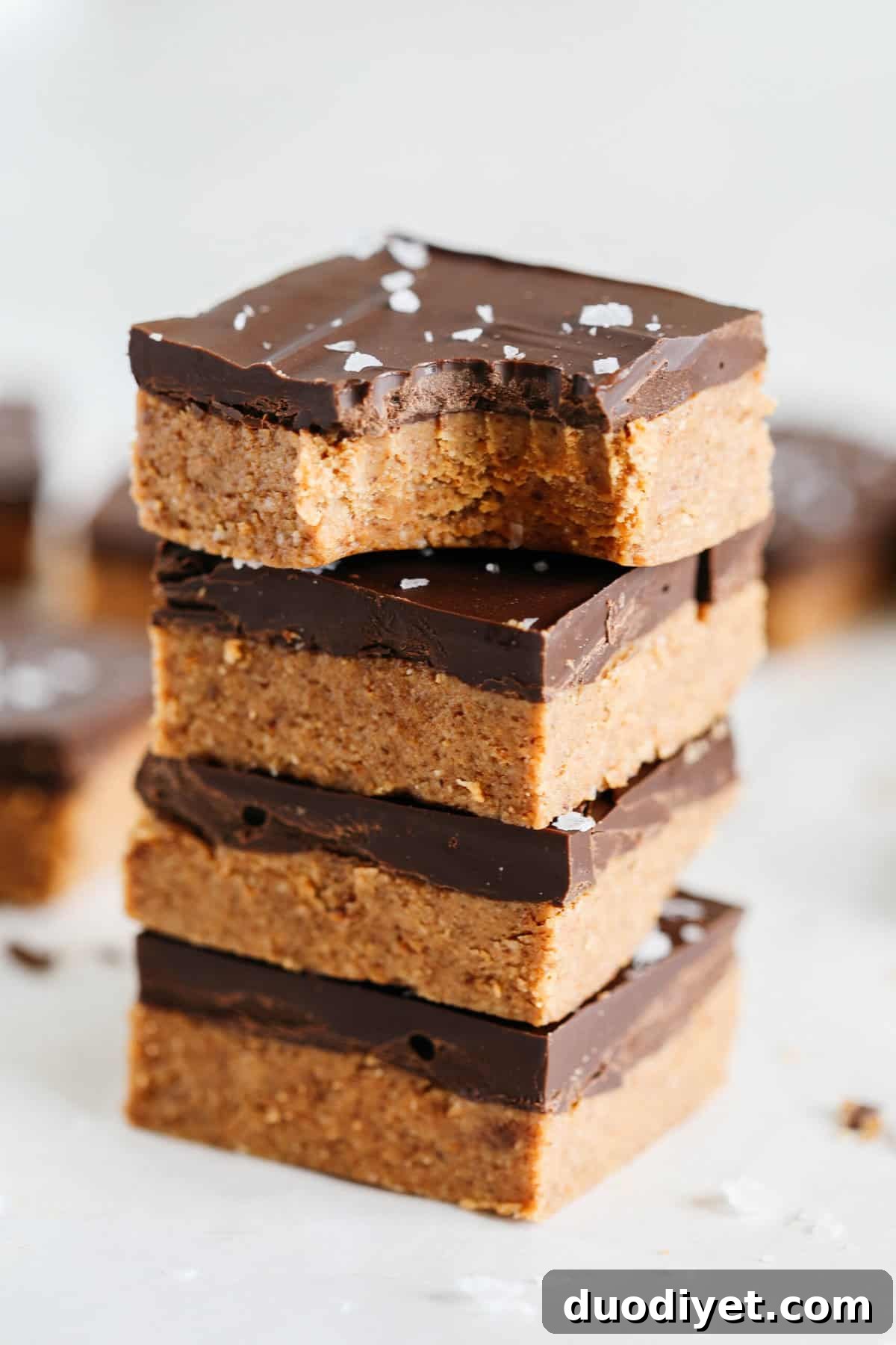 These Dark Chocolate Almond Butter Bars are rich, fudgy and make the perfect sweet treat with just a few simple ingredients and zero baking required!