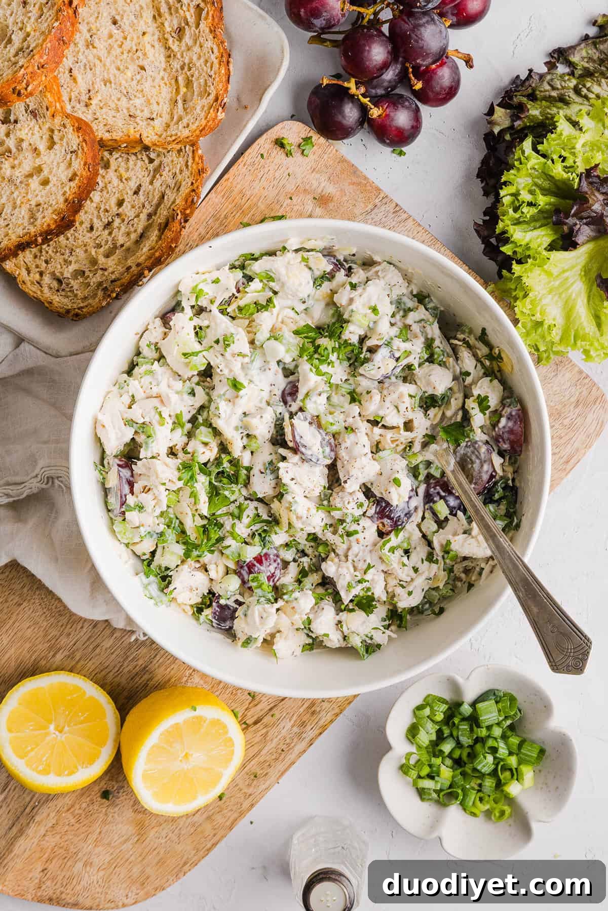 This Healthy Chicken Salad is creamy, fresh and packed with protein! Made with tender chicken, Greek yogurt in place of mayo, crunchy celery, grapes, and sliced almonds for a delicious, easy lunch or meal prep option you'll make on repeat!