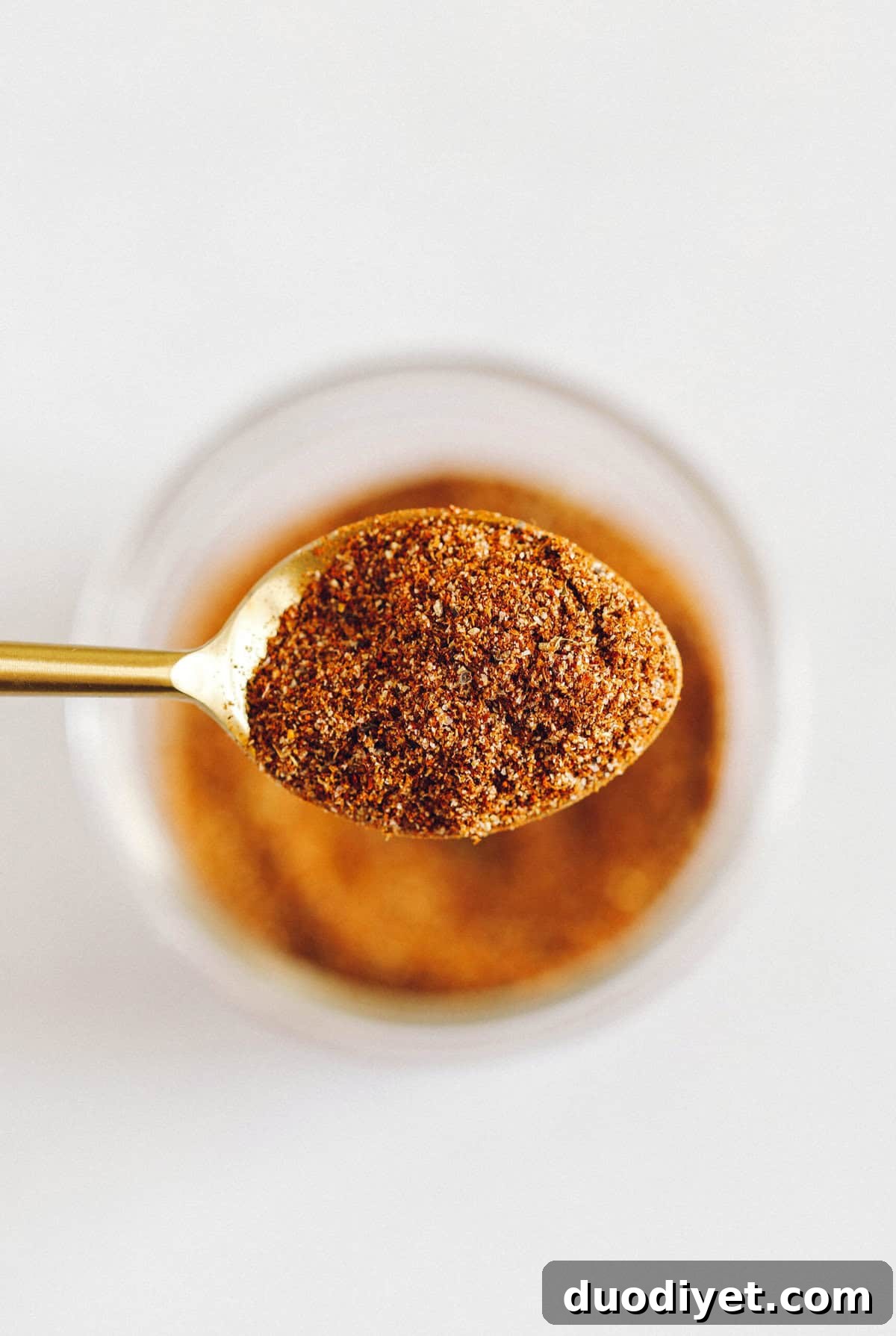 Homemade Taco Seasoning Recipe for Authentic Flavor 4 Jar of homemade taco seasoning next to dishes