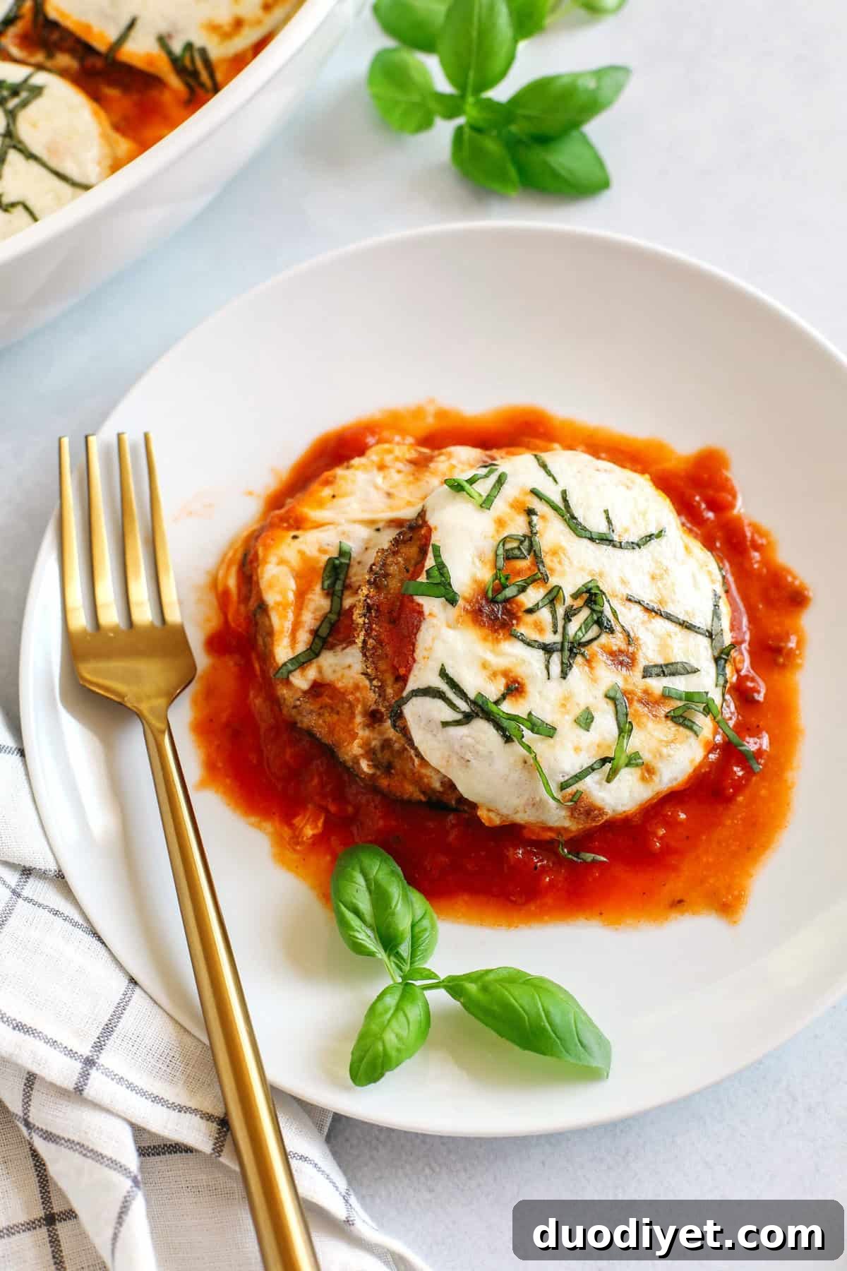Crispy Air Fryer Eggplant Parmesan Recipe 2 Air fried crispy eggplant layered with melty cheese and marinara for the perfect low carb comfort food you can easily make any night of the week!