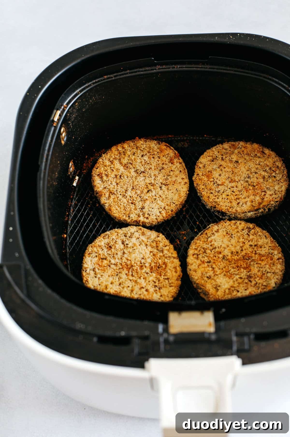 Crispy Air Fryer Eggplant Parmesan Recipe 4 Air fried crispy eggplant coated in almond flour and layered with melty cheese and marinara for the perfect low carb comfort food you can easily make any night of the week!