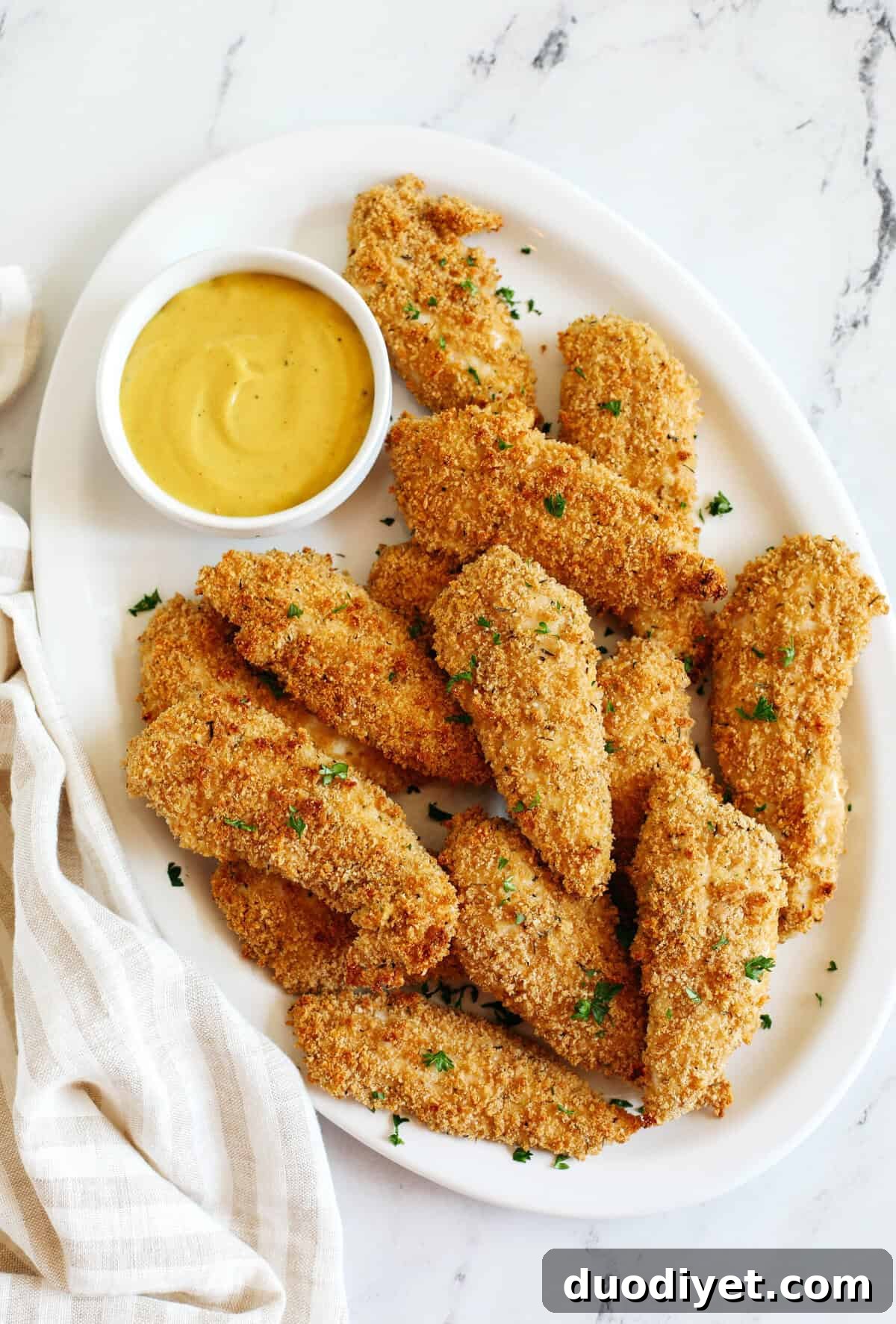 Crispy Oven-Baked Chicken Tenders 2 Easy Baked Chicken Tenders that are perfectly crispy, full of flavor and easily made in just 20 minutes! So delicious served with your favorite dipping sauce!