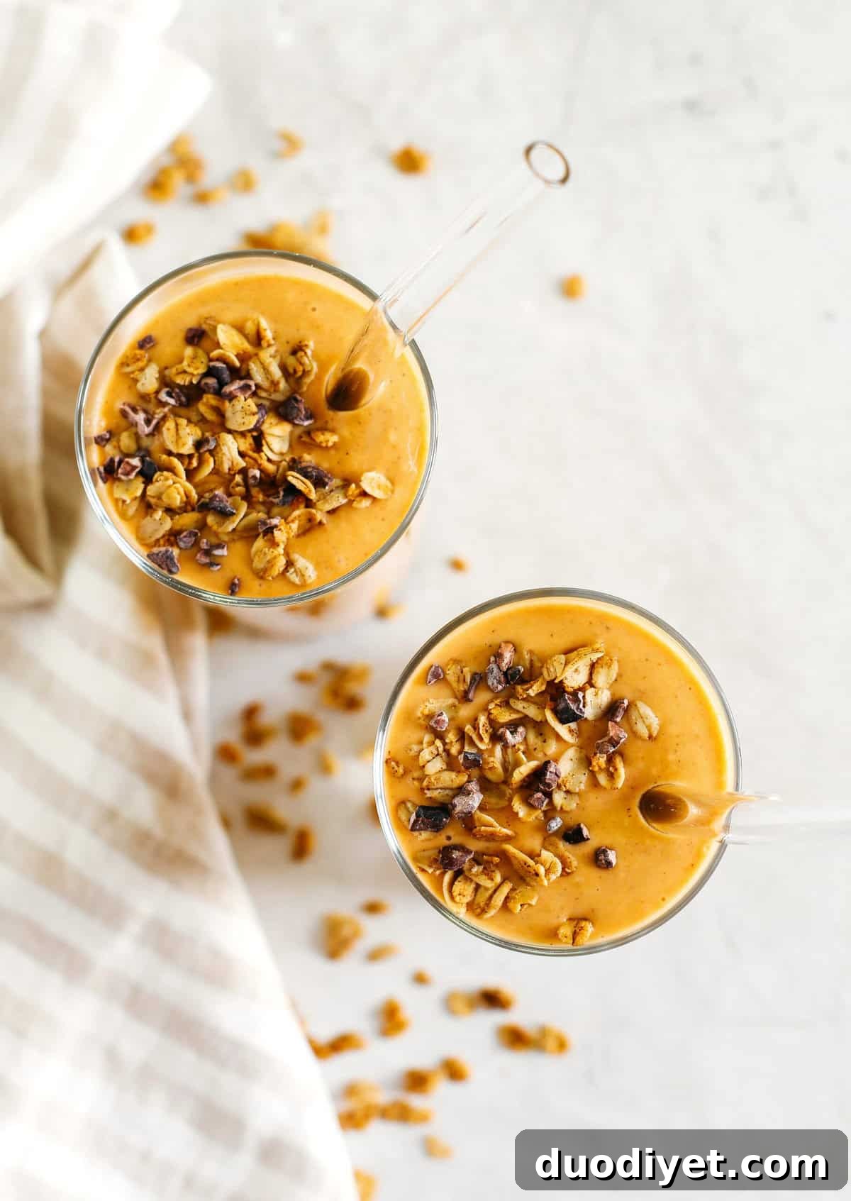 Start your morning off with this thick and creamy Pumpkin Spice Smoothie that is healthy, delicious and loaded with all your fall favorites like pumpkin, apple, banana, Greek yogurt, maple syrup and warm spices!
