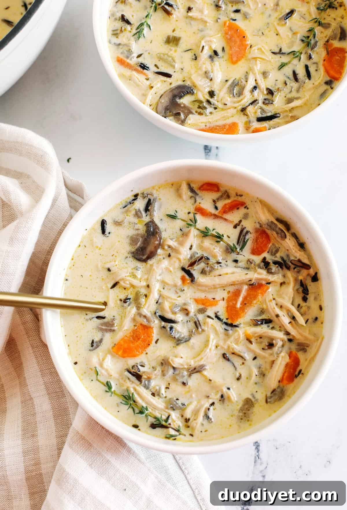 Creamy Chicken and Wild Rice Soup that is delicious, loaded with veggies and makes the perfect cozy meal that can easily made in your instant pot, slow cooker or right on the stove!