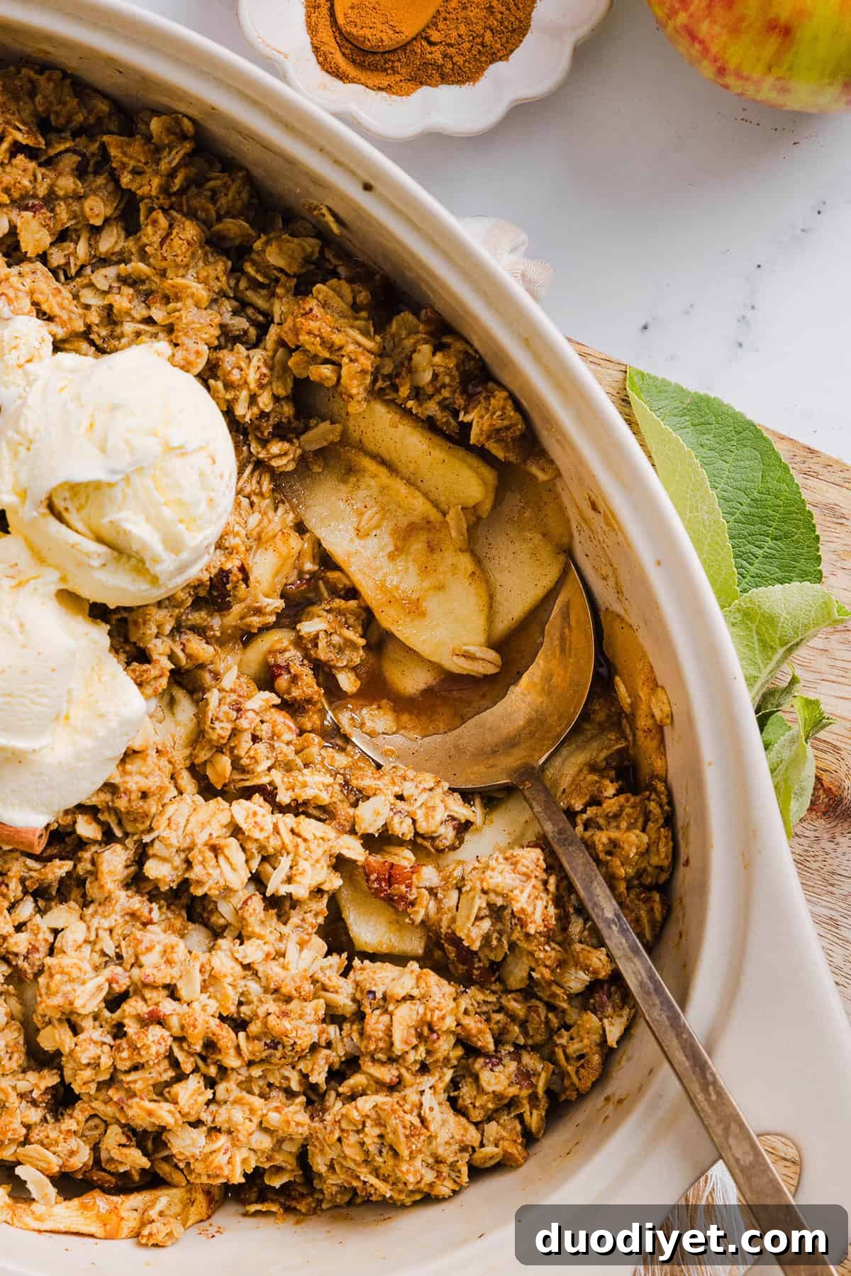 This Healthy Apple Crisp is loaded with tender apples and warm spices, naturally sweetened with maple syrup, all topped with a crunchy oatmeal pecan topping for the perfect fall dessert!