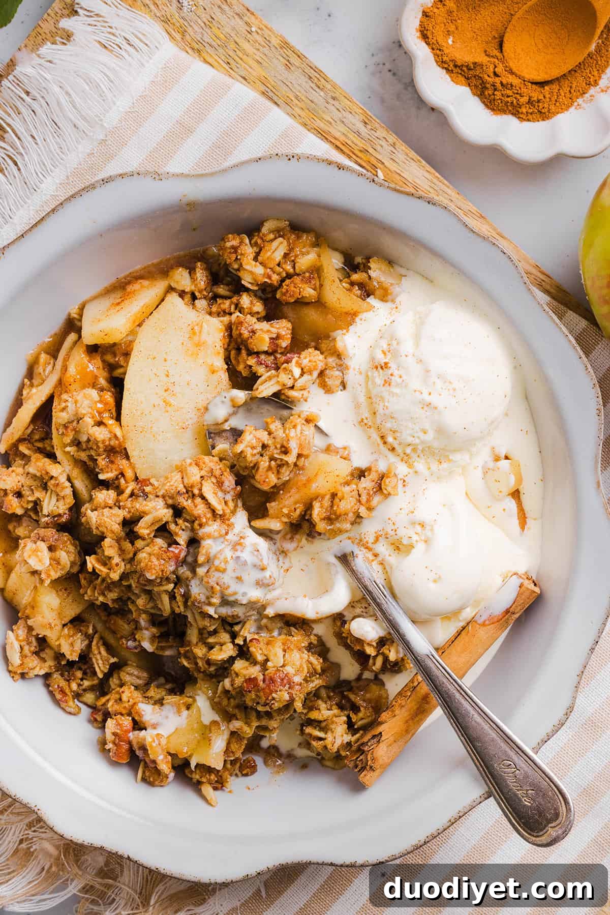 This Healthy Apple Crisp is loaded with tender apples and warm spices, naturally sweetened with maple syrup, all topped with a crunchy oatmeal pecan topping for the perfect fall dessert!