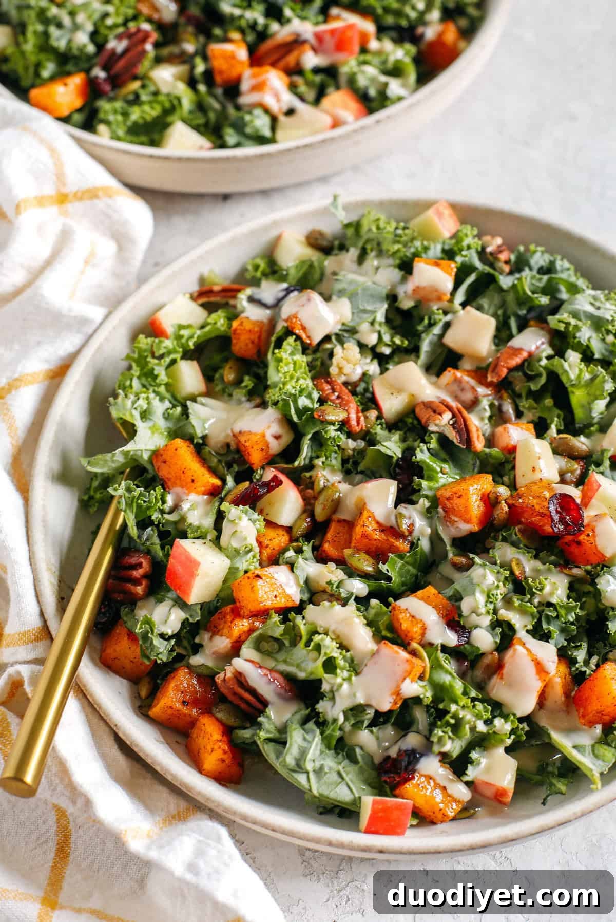 Fall Harvest Salad with Maple Tahini Dressing 2 The ultimate powerhouse Fall Salad made with leafy kale, protein-packed quinoa, crisp apples, roasted butternut squash, spiced pepitas and pecans, all drizzled in the most delicious maple tahini dressing!