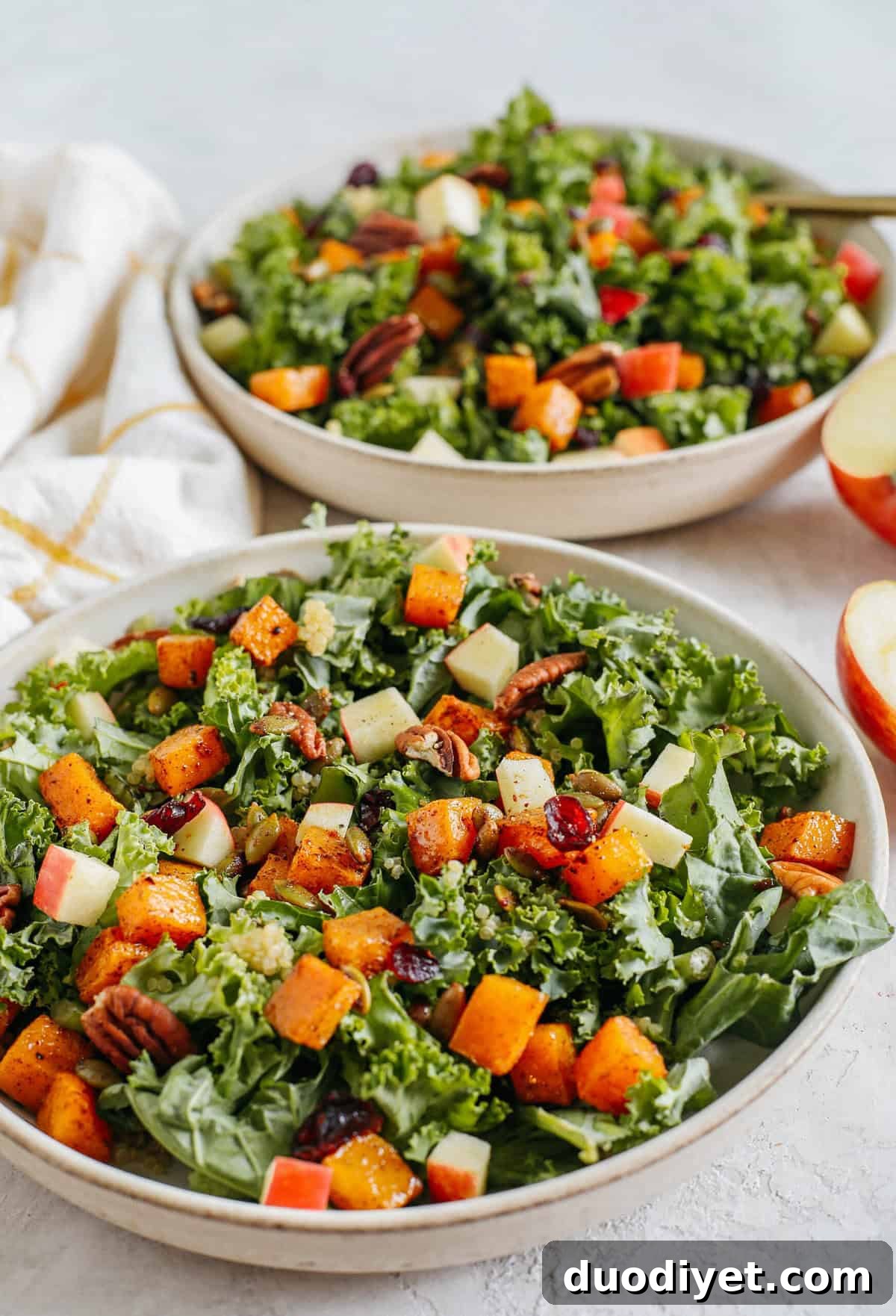 Autumn Harvest Salad with Maple Tahini Dressing 5 The ultimate powerhouse Fall Salad made with leafy kale, protein-packed quinoa, crisp apples, roasted butternut squash, spiced pepitas and pecans, all drizzled in the most delicious maple tahini dressing!