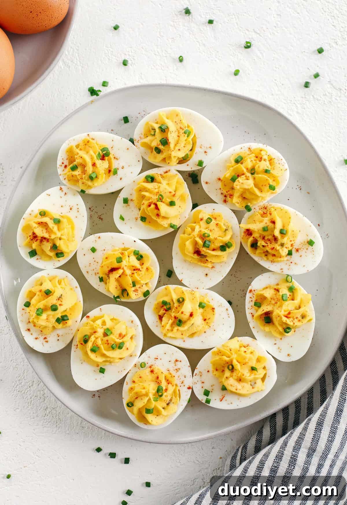 These Healthier Deviled Eggs are a classic recipe that are much lighter in calories thanks to using Greek yogurt! Perfect for parties, Sunday brunch or even a delicious afternoon snack!