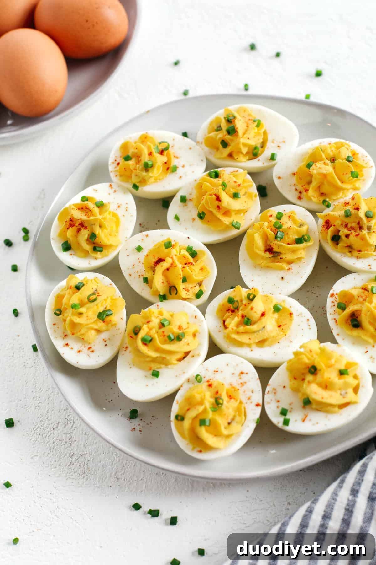 These Healthier Deviled Eggs are a classic recipe that are much lighter in calories thanks to using Greek yogurt! Perfect for parties, Sunday brunch or even a delicious afternoon snack!