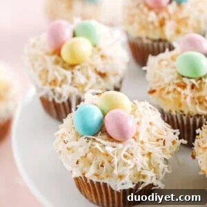 Celebrate Easter with these festive Bird's Nest Carrot Cake Cupcakes that are super moist, naturally sweetened with maple syrup and applesauce, all topped with a cream cheese frosting, toasted coconut and chocolate candies!