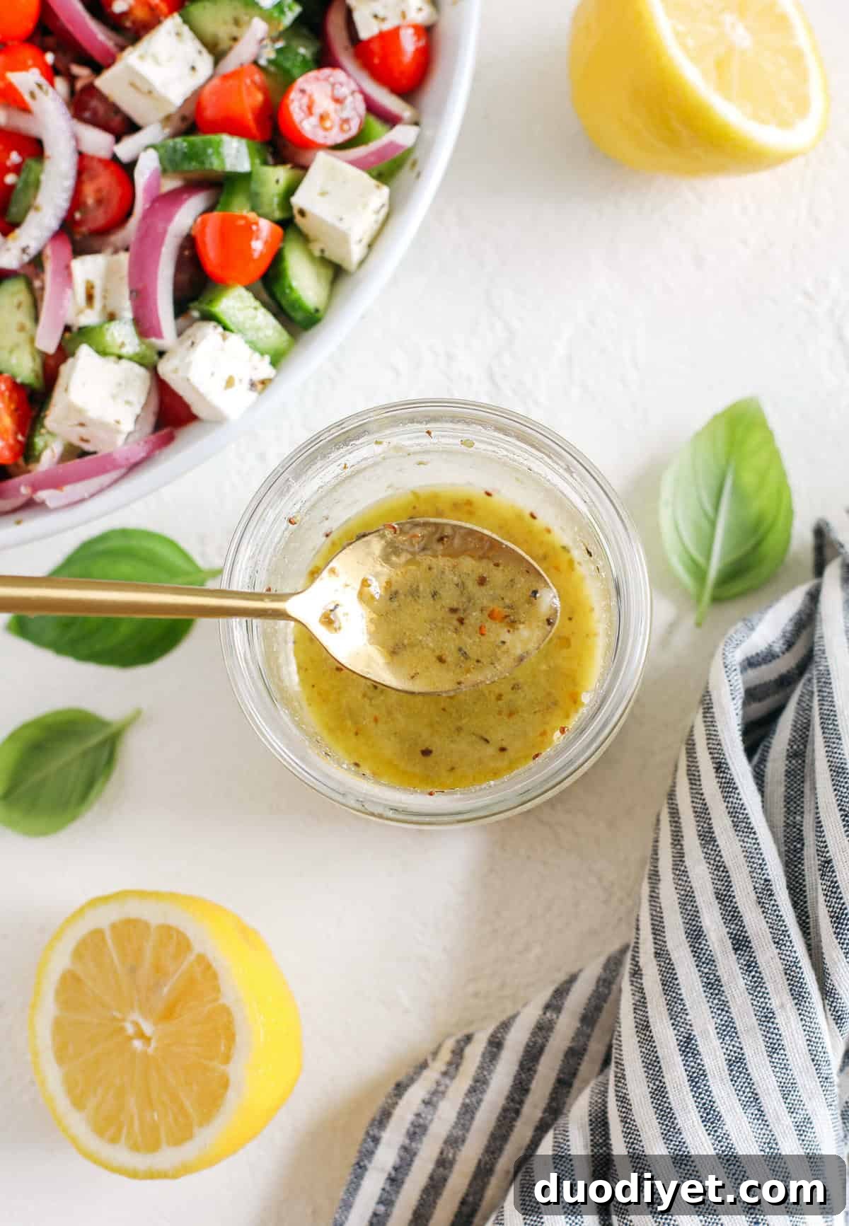 The most delicious homemade Greek Salad Dressing made with simple pantry ingredients perfect over salads, veggies, used as a marinade, pasta salads and more!