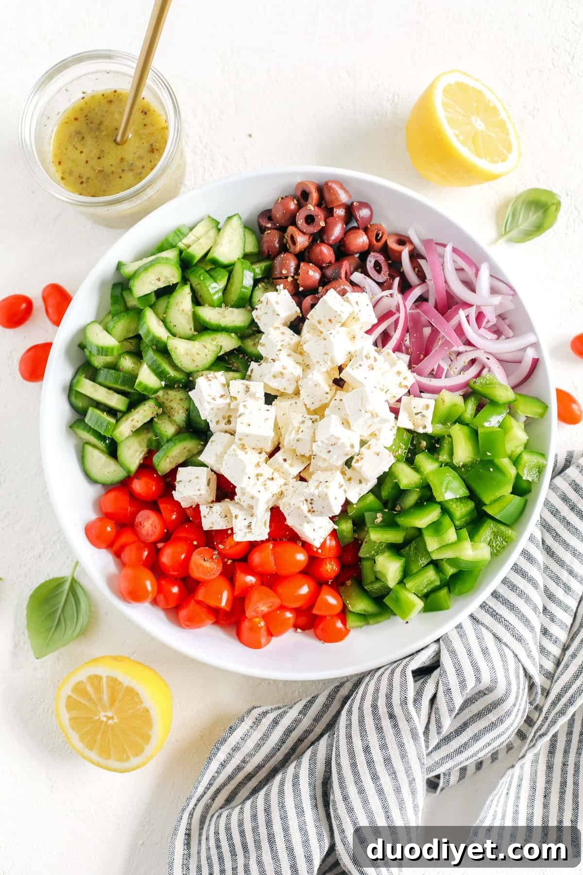 Authentic Greek Salad Recipe with Feta, Cucumber and Olives 3 Easy and delicious Healthy Greek Salad made with fresh tomatoes, crisp cucumbers, red onion, bell pepper, kalamata olives and feta cheese all tossed with a bright lemon vinaigrette!