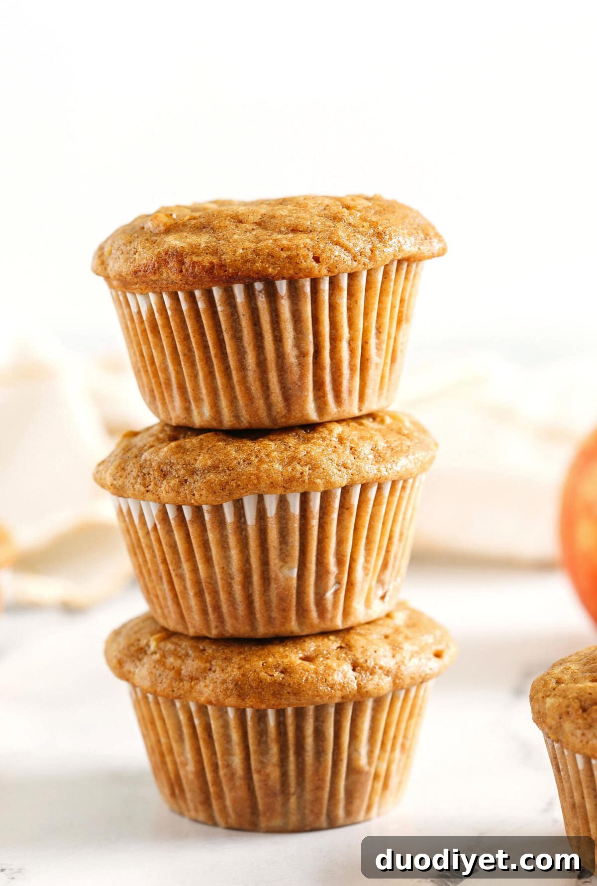 These Healthy Apple Cinnamon Muffins are moist, fluffy, and made healthier with whole wheat flour, Greek yogurt, and zero butter or refined sugar! Loaded with delicious chunks of apple and warm spices for the perfect fall muffin!