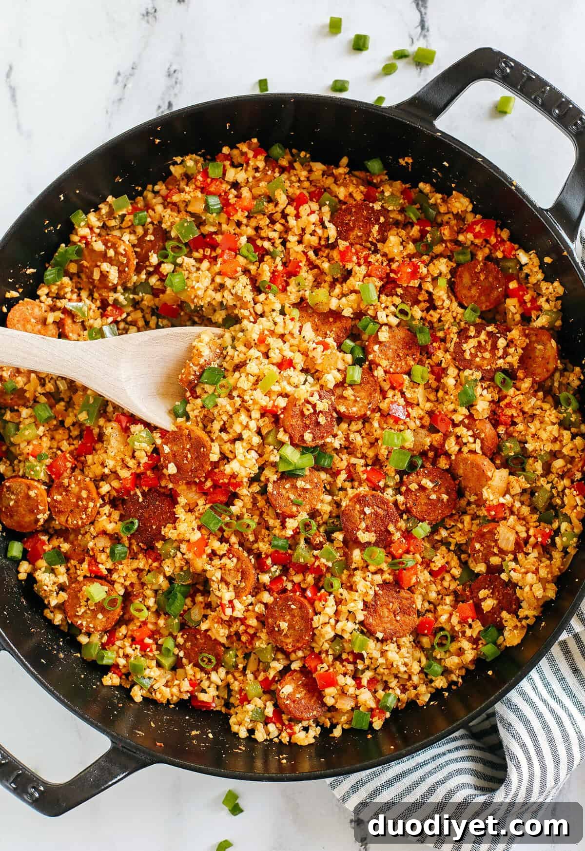 One-Skillet Cajun Sausage with Cauliflower Rice 2 Cajun Sausage and Cauliflower Rice Skillet with peppers, onions, and andouille chicken sausage