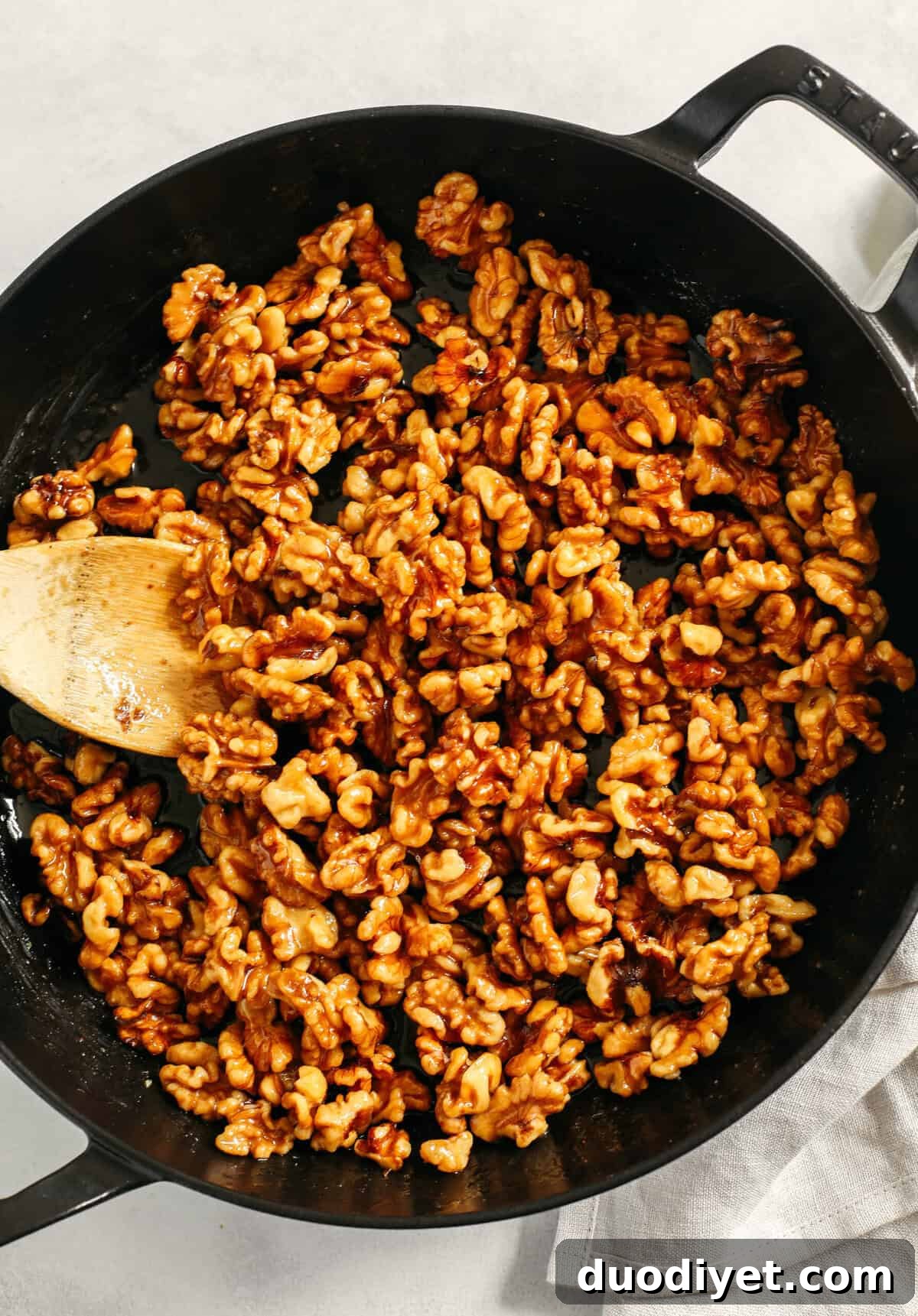 Sweet and crunchy Candied Maple Walnuts easily made in under 10 minutes with only 4 simple ingredients and naturally sweetened with maple syrup, vanilla and cinnamon! The perfect addition to salads, cheeseboards, desserts or enjoy as a delicious snack!