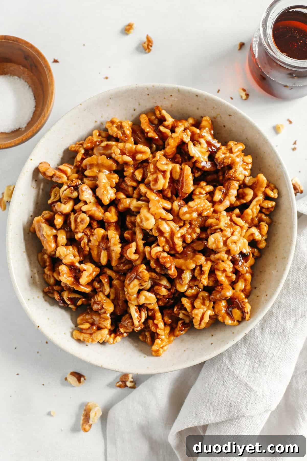 Sweet and crunchy Candied Maple Walnuts easily made in under 10 minutes with only 4 simple ingredients and naturally sweetened with maple syrup, vanilla and cinnamon!